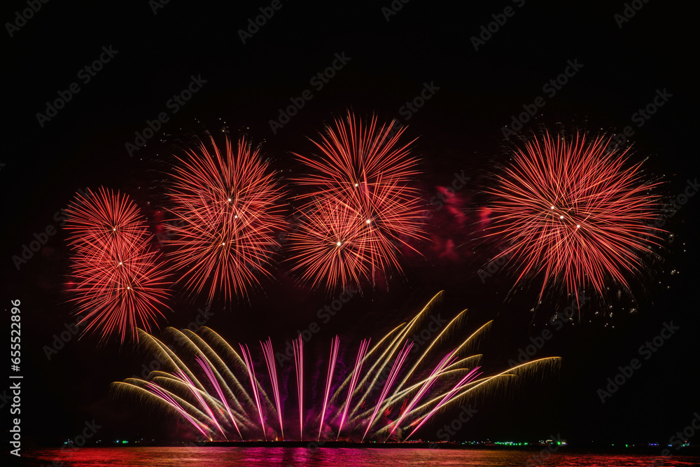 fireworks of various colors at night with celebration and anniversary concept