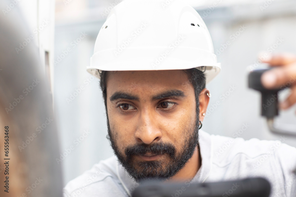 engineer with helmet working outside engineer with helmet working outside