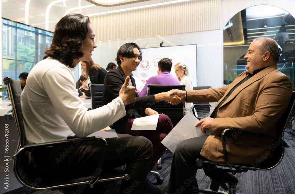 Group of diverse business people attending a meeting in a modern office. Group of diverse business people attending a meeting in a modern office.