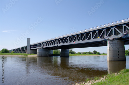 View over a famous wonder water bridge for ship navigation canal near Magdeburg at sunny day and blue sky, Magdeburg, Germany.