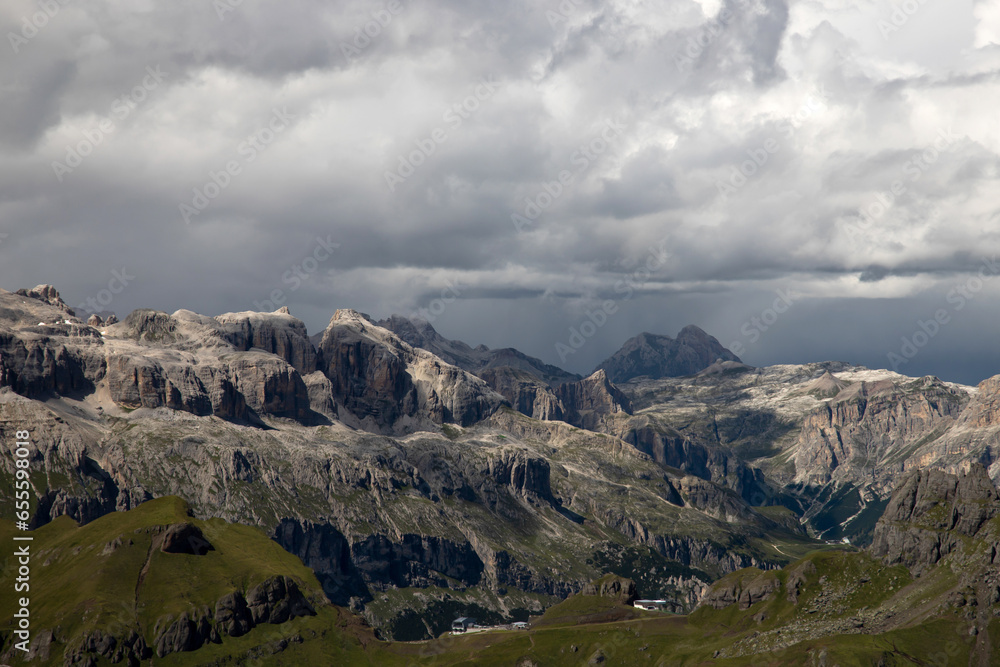 Fototapeta premium Panoramic view from the top of the Marmolada Glacier in summer mist, Dolomites, South Tyrol, Italy.