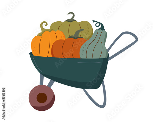 A garden cart with pumpkins inside. Harvest and Thanksgiving concept.	
