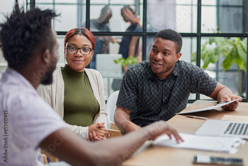 In a modern office. a diverse team of managers at a company meeting to discuss business projects.