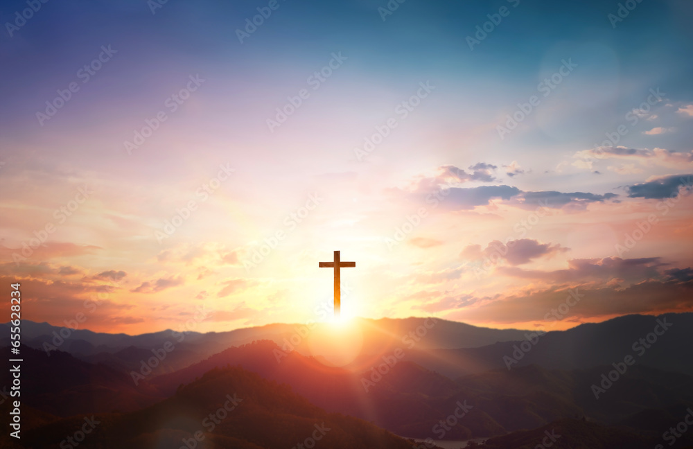 Silhouette of Jesus with Cross over calvary sunset background
