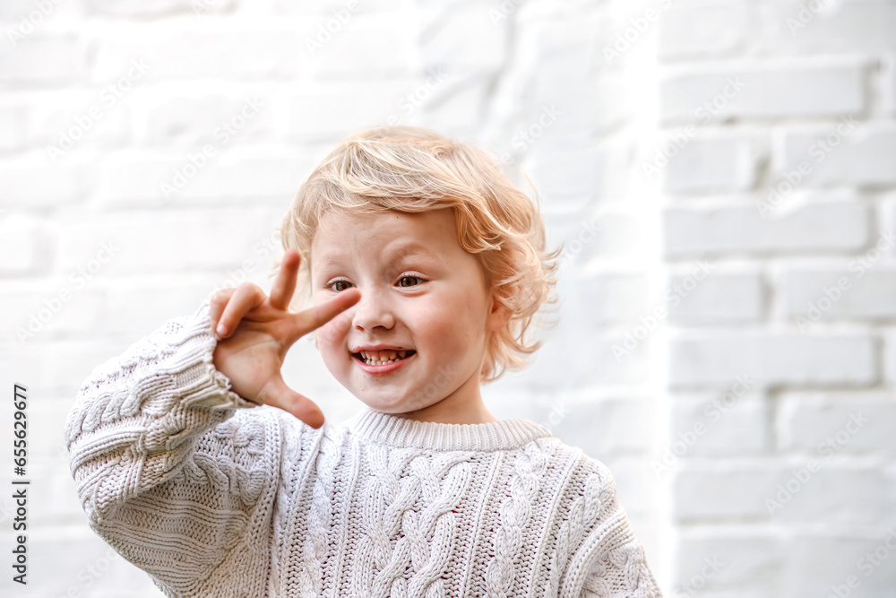 With a beaming smile, the little one proudly shows four tiny fingers, full of innocence and wonder. With a beaming smile, the little one proudly shows four tiny fingers, full of innocence and wonder.