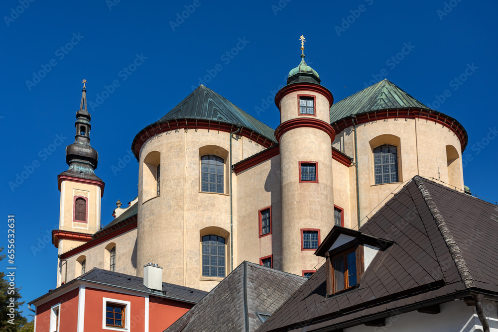 Gothic medieval church, Piarist Church of the Finding of the Holy Cross at sunny summer day, Monastery Garden, Litomysl, Czech Republic