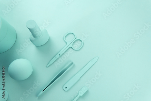 Cosmetcs tools for nail polish mint background