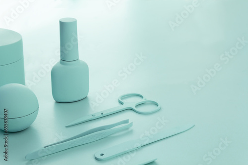 Cosmetcs tools for nail polish mint background