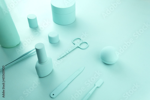 Cosmetcs tools for nail polish mint background