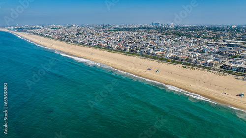 Fototapeta Naklejka Na Ścianę i Meble -  Manhattan Beach, Los Angeles, California, USA - 23-10-1, aerial landscape view of Manhattan Beach at South Bay with people walking on the beach