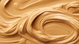 Close up of tasty creamy peanut butter with peanut nuts. Food background with free place for text