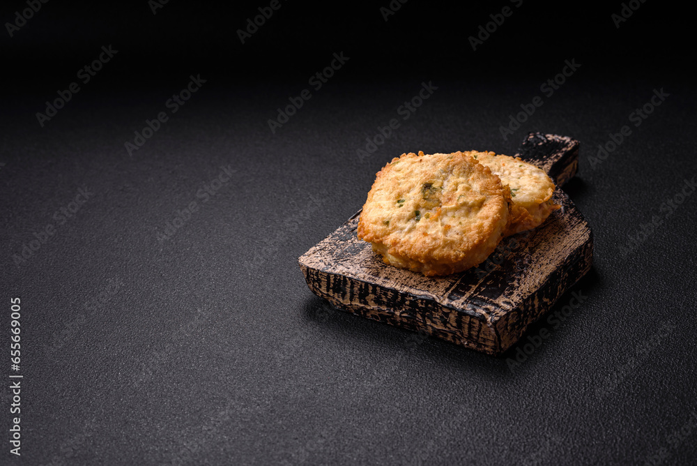 Delicious fried minced fish cutlets or meatballs with salt, spices and herbs Delicious fried minced fish cutlets or meatballs with salt, spices and herbs