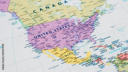 Close-up of the country word United States on a world map with the detailed name of the capital city. Camera zoom out.