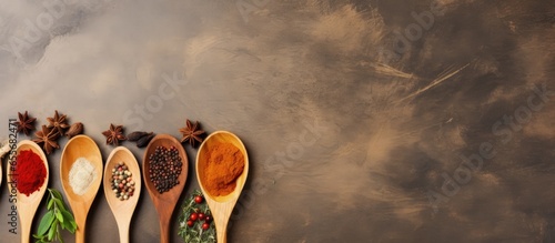 Vegetarian concept with wooden spoon and ingredients on old background associated with health and cooking with copyspace for text