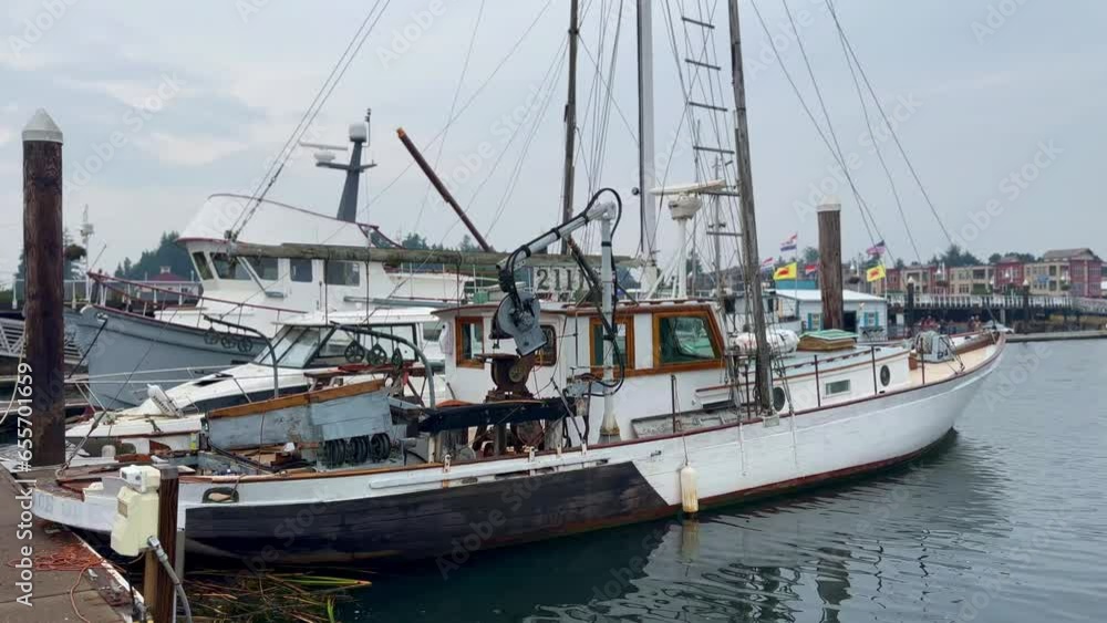 Fishing Boat Anchored On The Port In Daytime in Florence, Oregon. wide Fishing Boat Anchored On The Port In Daytime in Florence, Oregon. wide
