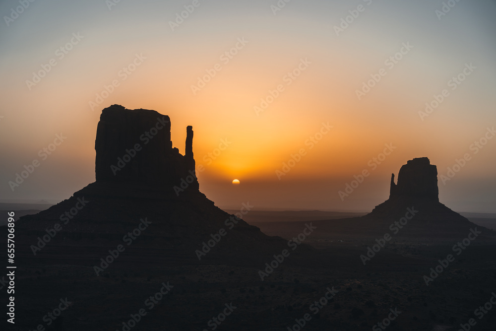 Monument Valley USA Utah during Sunset and sunrise with famout view to the sisters and west mitten butte
