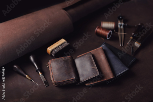 Case, purse made of natural leather brown color with tools. Concept banner tailor products make from skin