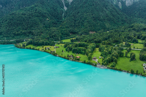 Aerial view of Brienzersee Lake in summertime during a rainy day with low clouds, Bonigen, Bern, Switzerland. photo