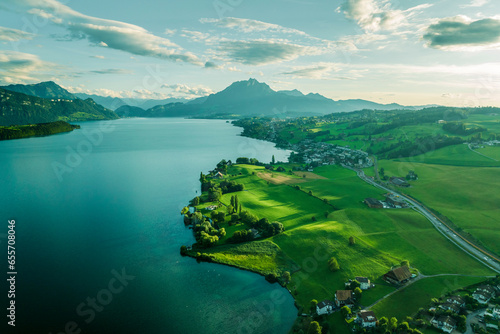 Aerial view of Mount Pilatus at sunset from Lake Lucerne, a mountain peak in Alpnach, Switzerland.
