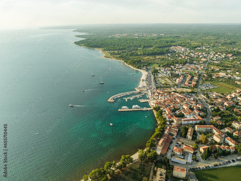 Aerial view of Fazana, a small town with a small harbour along the Adriatic Sea coastline, Istria, Croatia. Aerial view of Fazana, a small town with a small harbour along the Adriatic Sea coastline, Istria, Croatia.