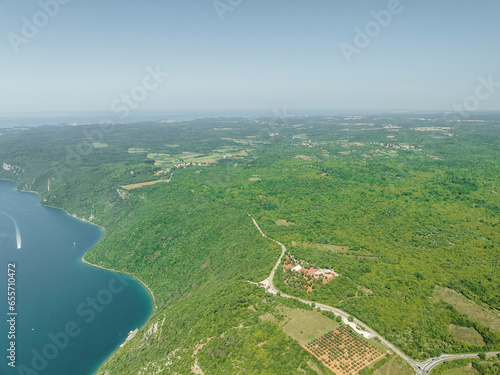 Aerial view of boats sailing along the Limski Fjord (Canal di Leme) in Sveti Lovrec, Istria, Croatia. photo