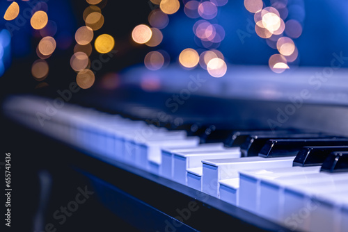 Photography Piano keys close-up on a blurred background with bokeh.