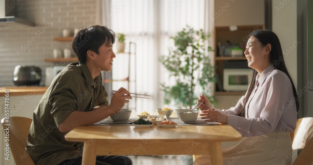 Excited South Korean Boyfriend Meeting His Girlfriend After a Long Trip. Happy Asian Couple Reunite, Hug Each Other at Home Spin and Fall Down on a Comfortable Sofa in a Stylish Living Room Excited South Korean Boyfriend Meeting His Girlfriend After a Long Trip. Happy Asian Couple Reunite, Hug Each Other at Home Spin and Fall Down on a Comfortable Sofa in a Stylish Living Room
