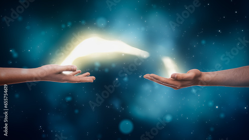 Visualization Of Two Hands Exchanging Bright Yellow Stream Of Magical Energy On Dreamy Dark Blue Background. Two People With Spiritual Connection Charging Each Other With Positive Power Concept