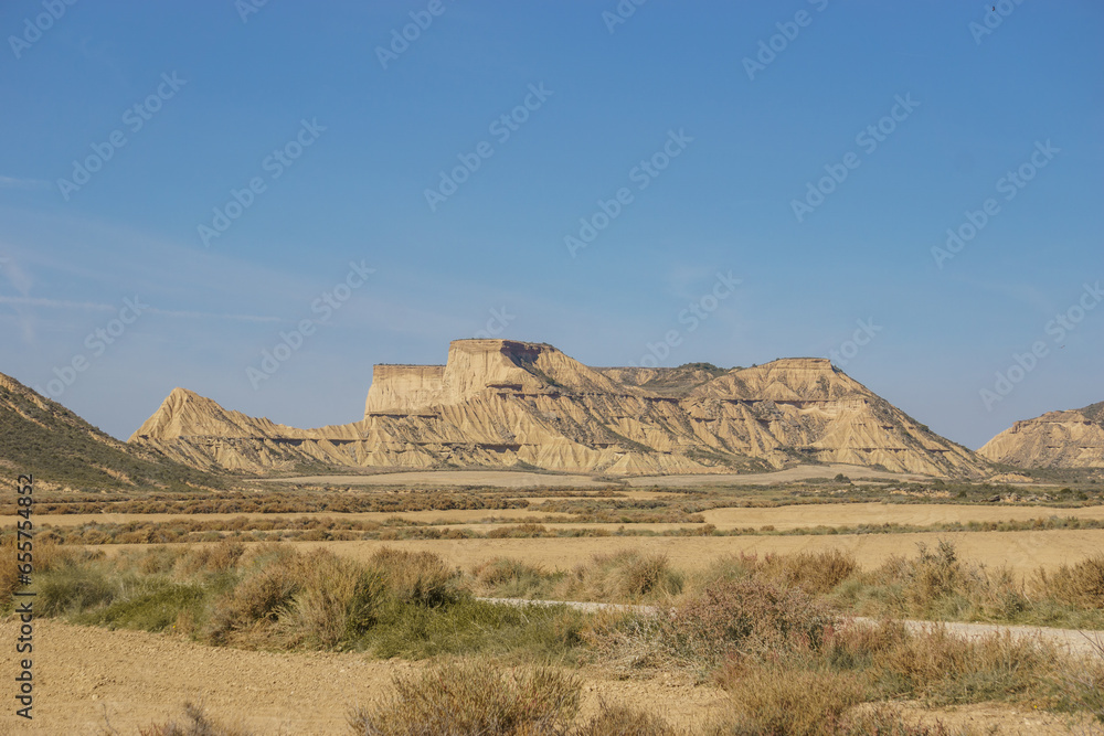 Bizarre rock formation out of sandstone and clay at desert landscape of the arid plateau of the Bardenas Reales, Arguedas, Navarra, Spain Bizarre rock formation out of sandstone and clay at desert landscape of the arid plateau of the Bardenas Reales, Arguedas, Navarra, Spain