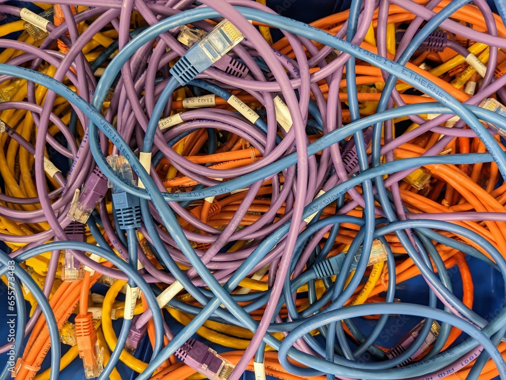 A tangle of different coloured CAT5 network cables
