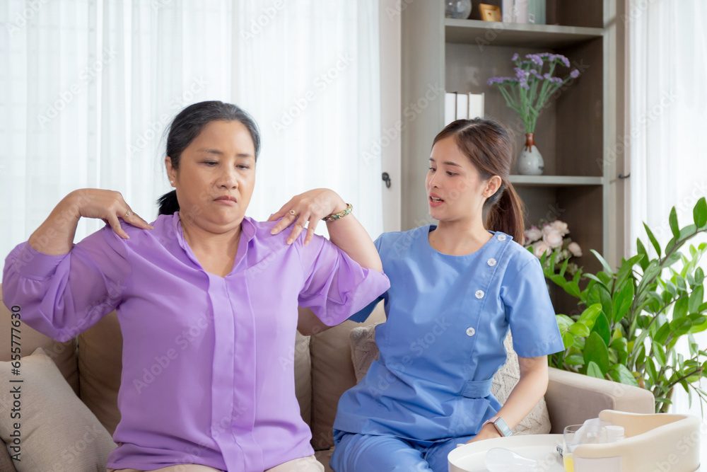 Asian caregiver woman or nurse training senior woman warmup for exercise while physical therapy and rehabilitation, caretaker or physiotherapist helping elderly workout with shoulder, medical concept. Asian caregiver woman or nurse training senior woman warmup for exercise while physical therapy and rehabilitation, caretaker or physiotherapist helping elderly workout with shoulder, medical concept.