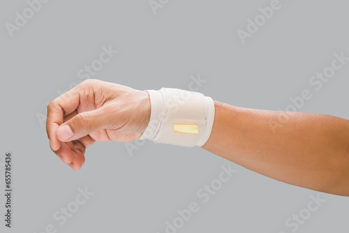 Картината върху платно The man wears a wrist support. to alleviate wrist pain.