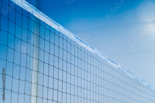 close-up sports equipment volleyball net on a closed blue court competition matches details