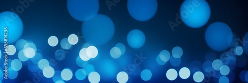 Blue bokeh lights on a blue background banner. Abstract blue background. Blue light dots banner.