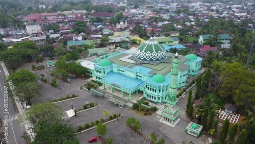 The Riyadhusshalihin grand mosque is located in the city of Barabai which is known as the city of Apam in Hulu sungai tengah district photo