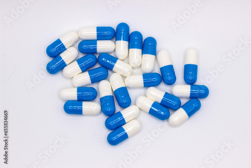 Blue and white medicines on a white background.
