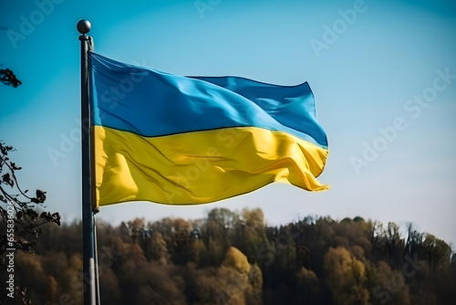 Ukrainian flag waving in the wind against blue sky with clouds, Independence Day, kiev day concept photo