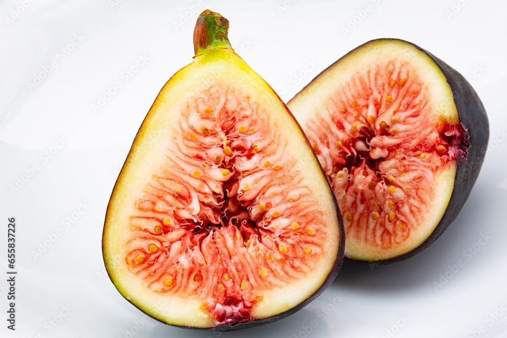 Macro of cut fig halves on white background Macro of cut fig halves on white background