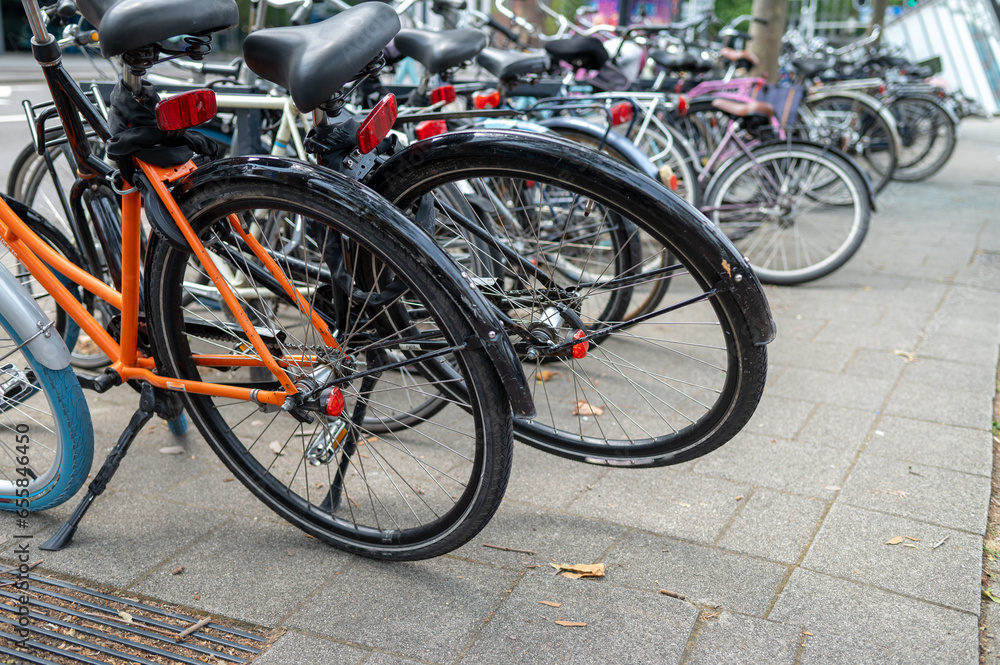 Group of bicycles seen parked on sidewalk
