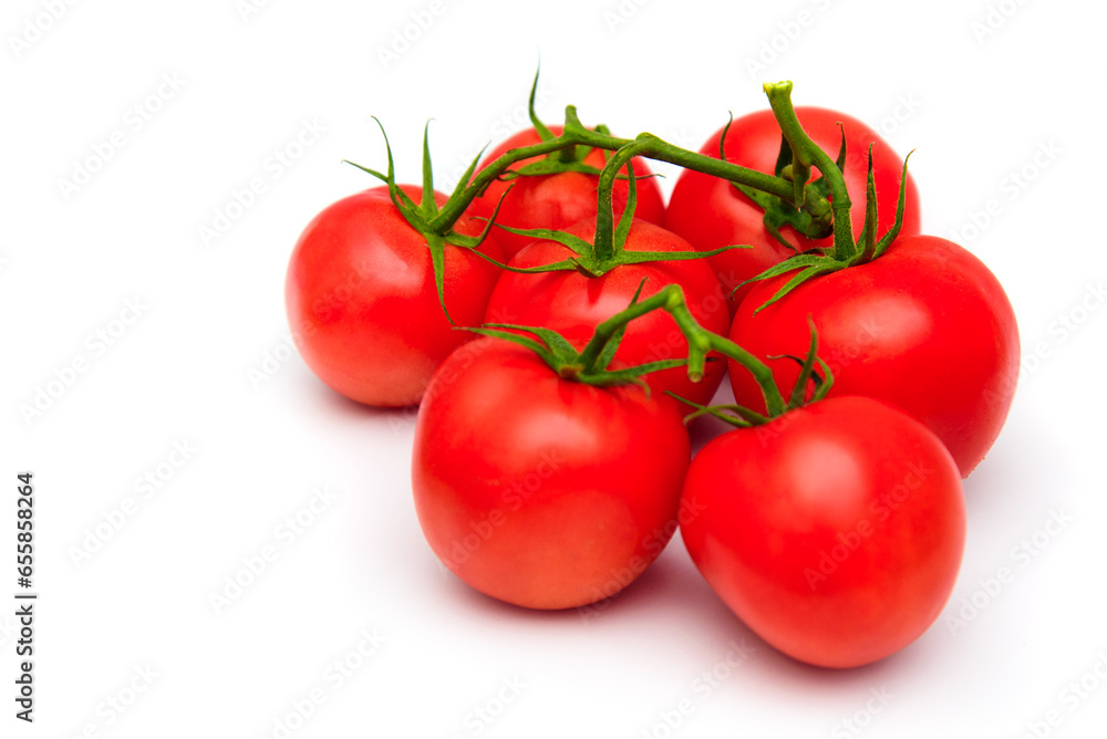 Tomatoes isolated on white background. Fresh ripe red tomatoes bunched.