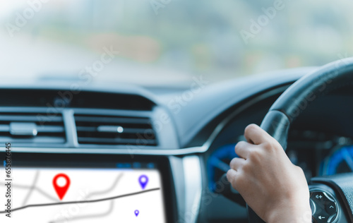 female hands, holding a steering wheel, car, driving a delivery, using a navigation device, through an online app, pinning goals, checking routes, practicing driving, testing, accident insurance.