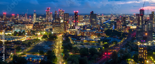 Aerial panoramic view of Manchester City skyline at night