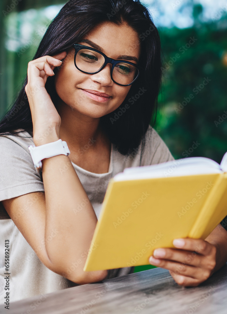 Fototapeta premium young caucasian woman fond of literature satisfied with interesting book on coffee break