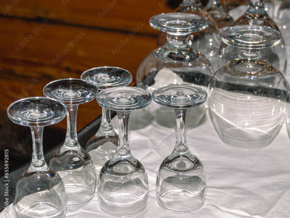 Washed glassware dries on the table. Transparent glasses are dried