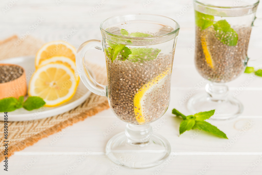 Healthy breakfast or morning with chia seeds lemon and mint on table background, vegetarian food, diet and health concept. Chia pudding with lemon and mint Healthy breakfast or morning with chia seeds lemon and mint on table background, vegetarian food, diet and health concept. Chia pudding with lemon and mint