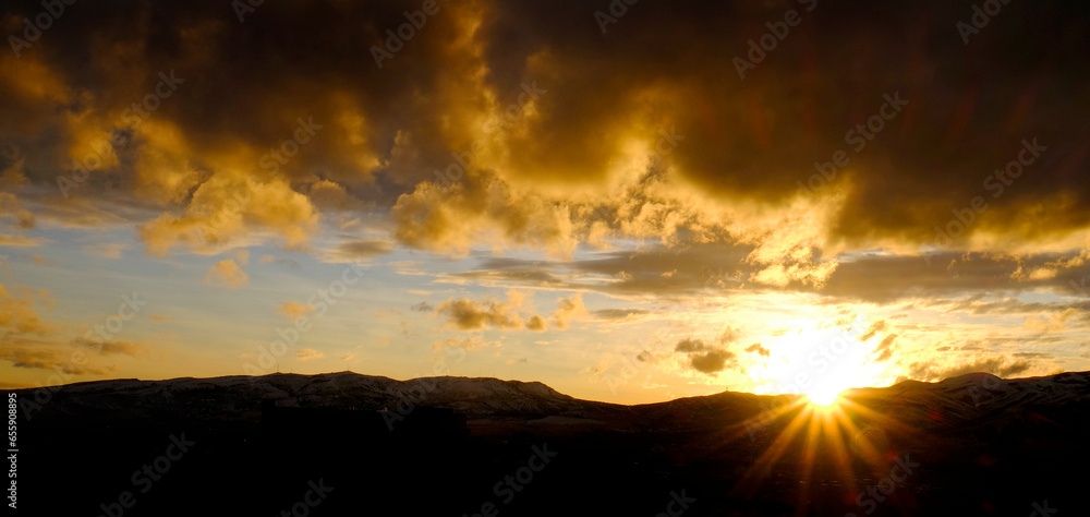 Sunset on Mountains Horizon Clouds Sunstar Sun star Glowing