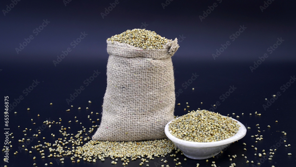 Heap of Pearl millet grain whole for indian gujarati food recipe Stock