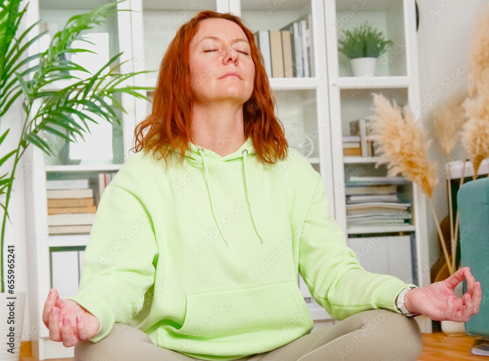 woman doing yoga and stretching exercises in her home. sport at home.