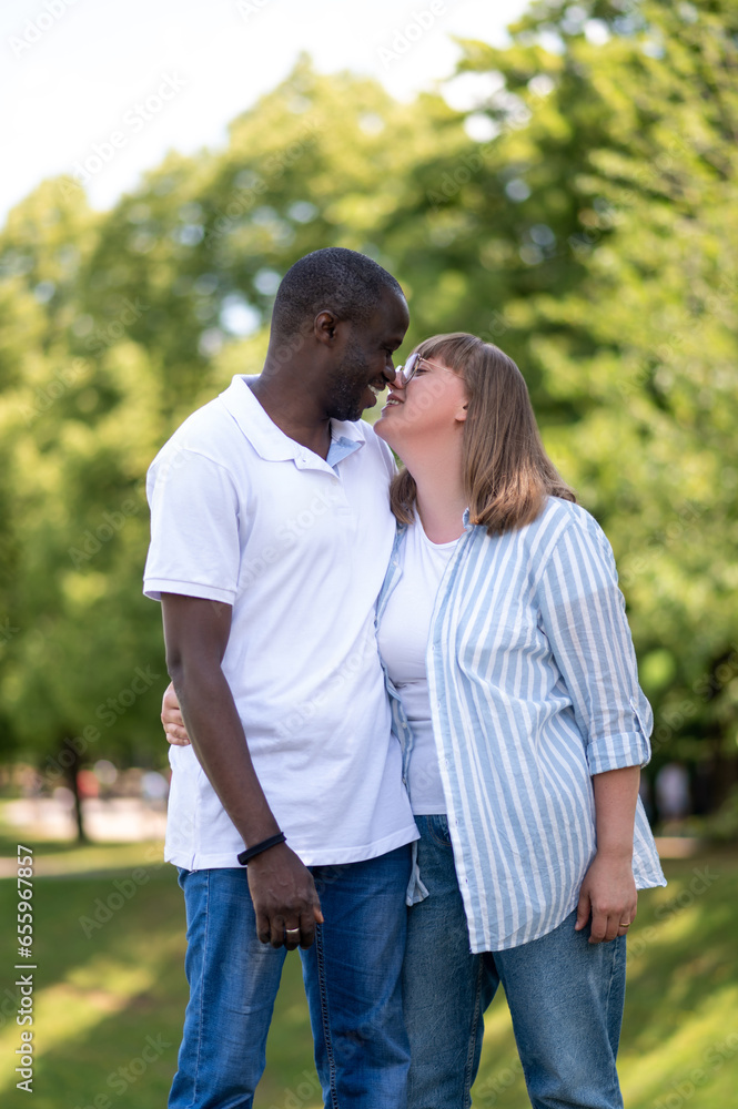 Happy couple in the park looking in love and romantic Happy couple in the park looking in love and romantic