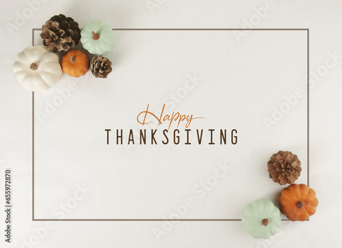 Happy Thanksgiving greeting background with flat lay of pumpkins in frame with modern minimalism style.